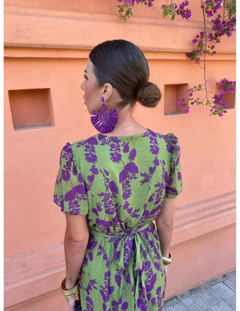Woman in green BobaFashion summer dress posing outdoors, showcasing the flowing skirt and modern cut