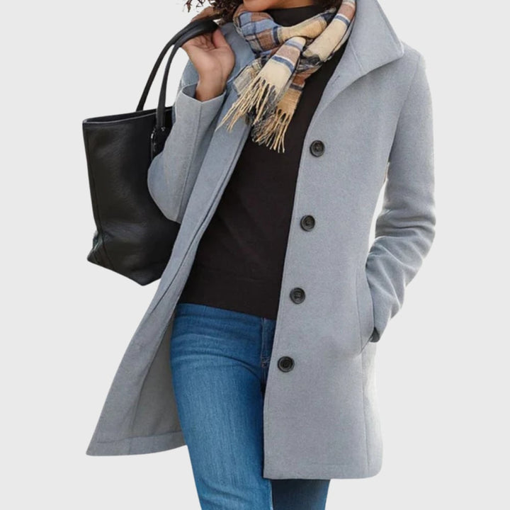 Woman styled in the Kimmy longline coat in light grey over a casual outfit for a polished everyday look