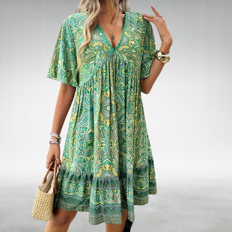 Front view of the Laurel boho mini dress in blue showing the flattering mini silhouette and paisley print
