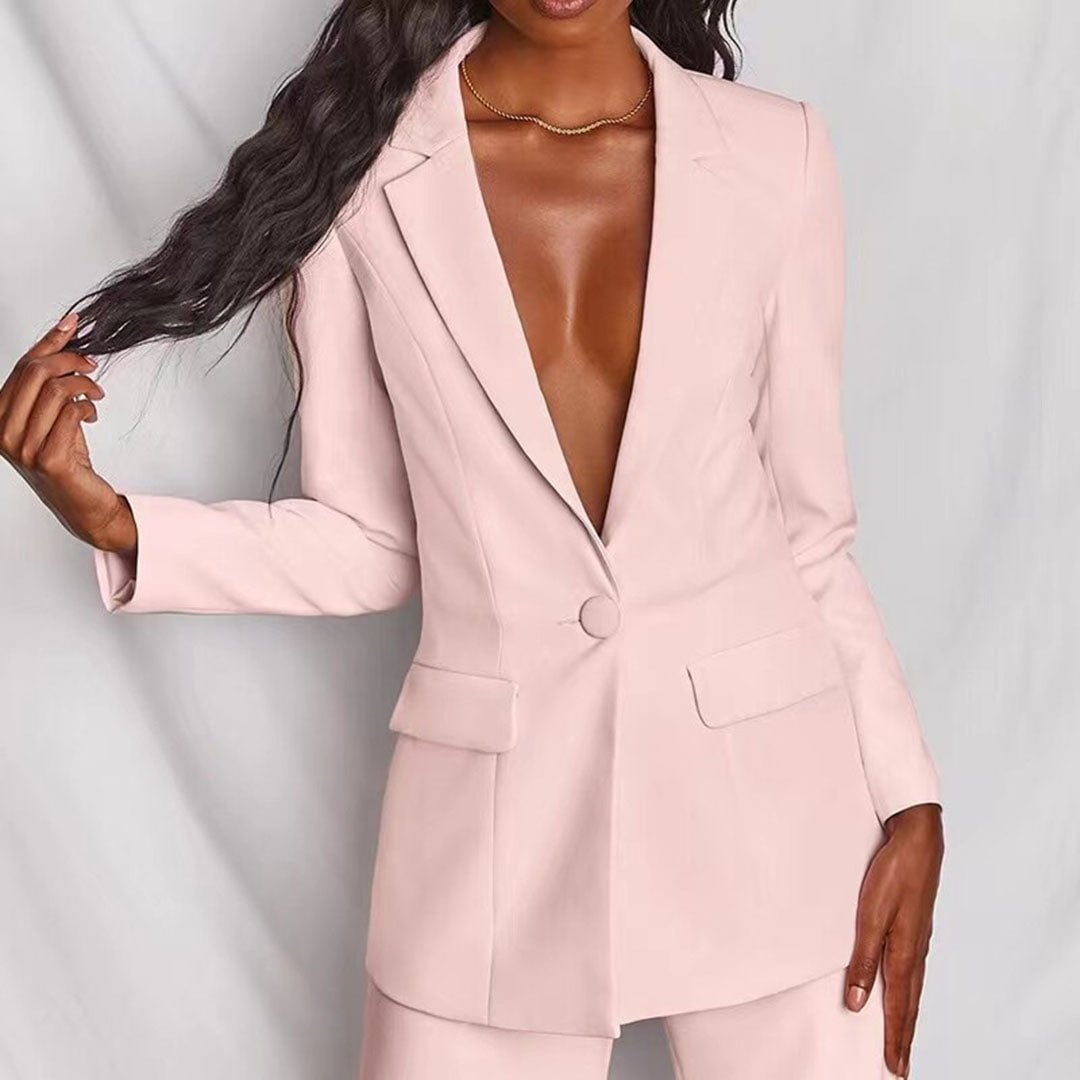 White two-piece blazer and trousers set styled elegantly on a model from BobaFashion