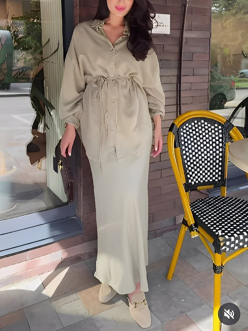 Model posing in the matching long-sleeve shirt and skirt set, full-length view