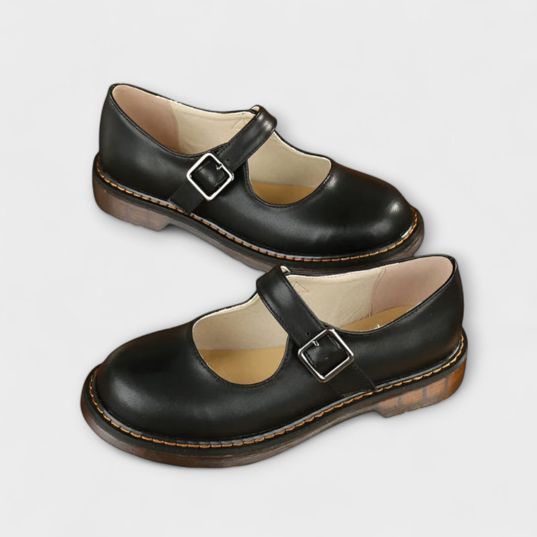 Pair of Lisa vintage sandals in brown displayed flat, highlighting the cushioned sole and classic Mary Jane silhouette