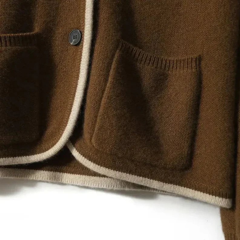 Close-up shoulder detail of the Londyn vintage cardigan in beige showing vintage-inspired design