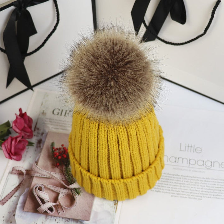 Lorette knit beanie in beige displayed on a neutral background