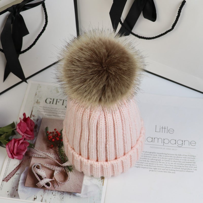 Model wearing the Lorette beanie in claret pulled low over her forehead