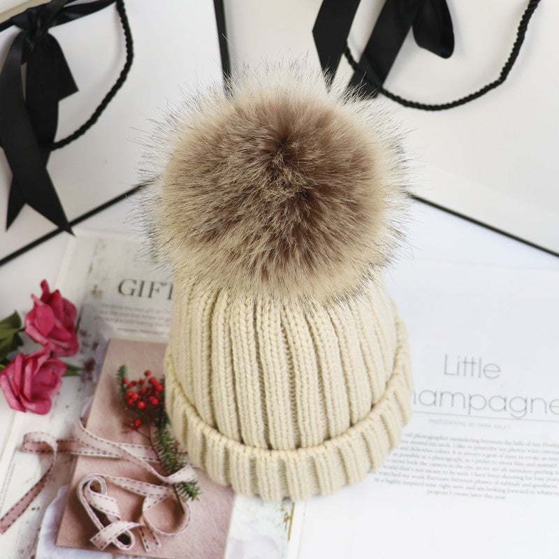 Close-up of the ribbed cuff detail on the Lorette knit beanie in beige