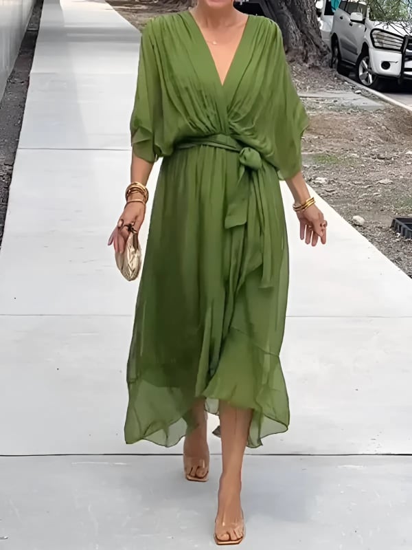 Woman wearing a timeless wrap midi dress with an adjustable waist tie in a flattering silhouette
