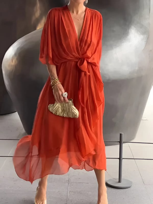 Full-length view of a woman in a wrap midi dress styled with heels for an elegant look