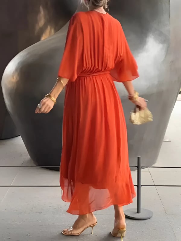 Side view of a wrap midi dress showing the flowing midi length and breathable fabric