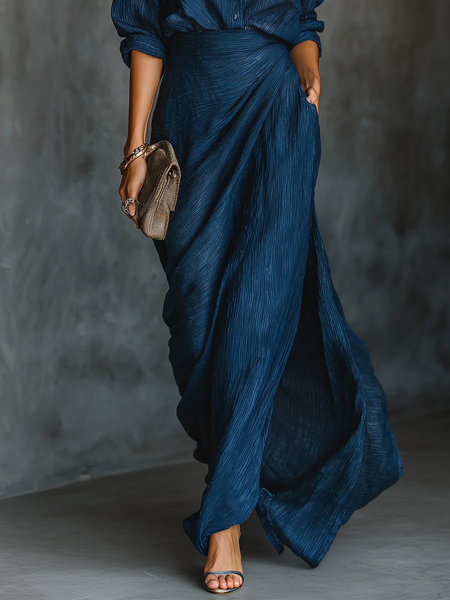 Model styled in a dark blue elegant shirt and maxi skirt matching set, full length view