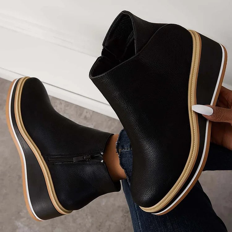 Lucille boots in blue shown from the back highlighting heel height and construction