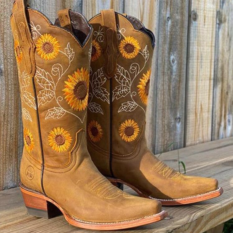 Woman wearing Luna bohemian boots in brown paired with a flowy dress for a festival look