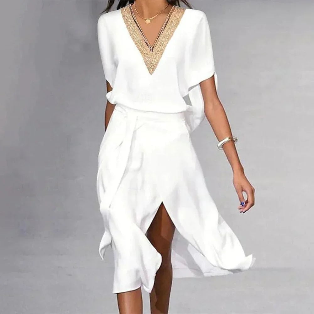 Side view of BobaFashion Lyra white midi dress showing flowing asymmetric hem and self-tie belted waist