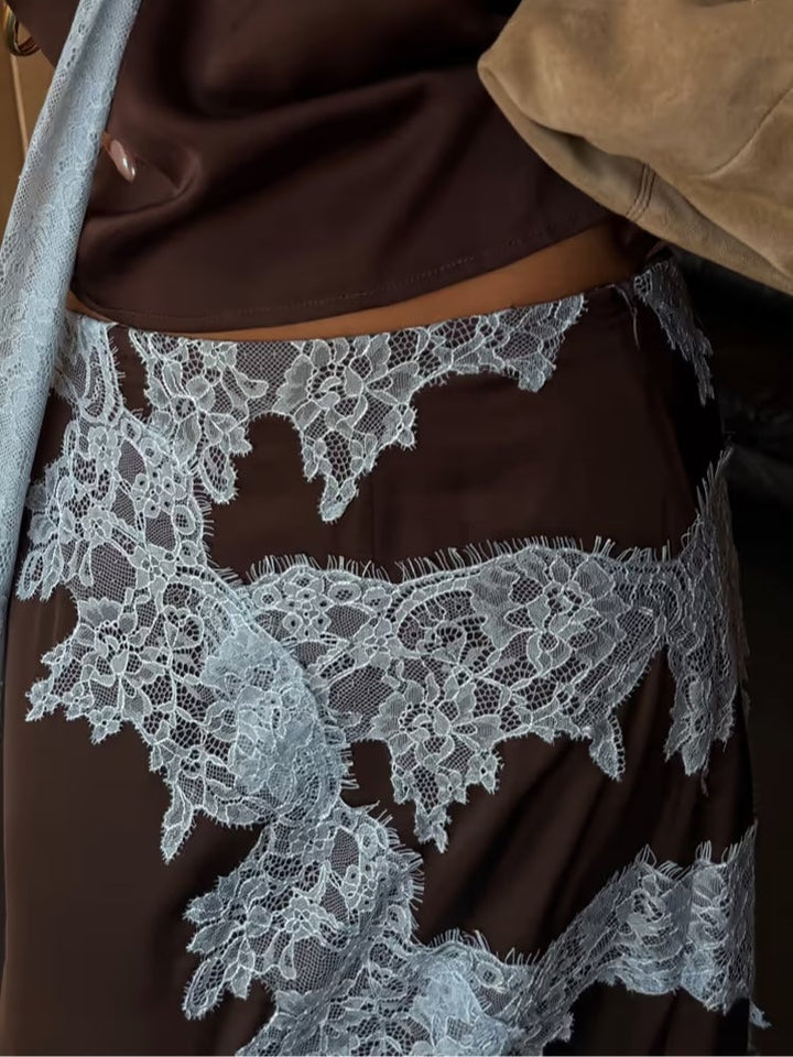 Flat lay of the brown lace panel top and matching skirt displayed together