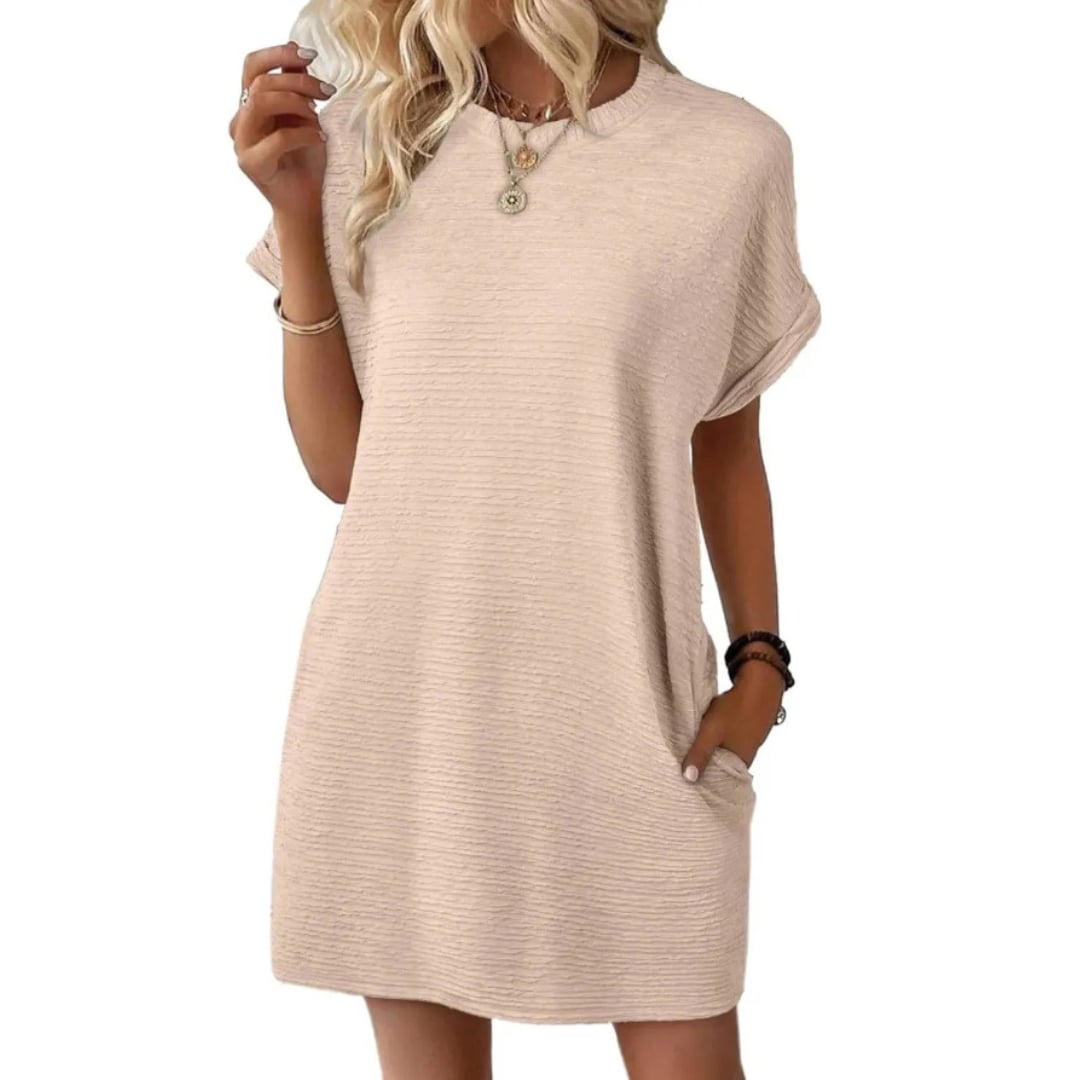 Close-up of the ribbed fabric texture on the Maggie t-shirt mini dress in Apricot