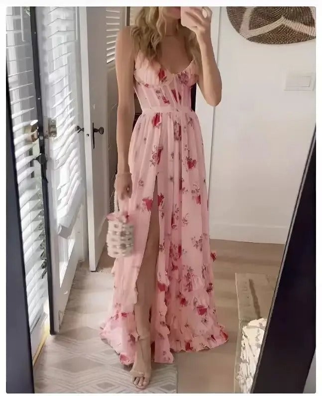 Woman wearing the Matilda floral wedding guest dress in pink with a flowing silhouette