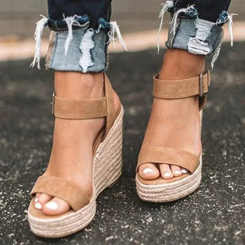 Women's woven espadrille wedge sandals with adjustable buckle ankle strap in brown, side view