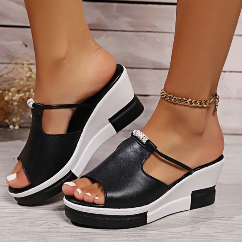 Minerva women's platform T-bar sandals in black, front view showing open toe and platform sole