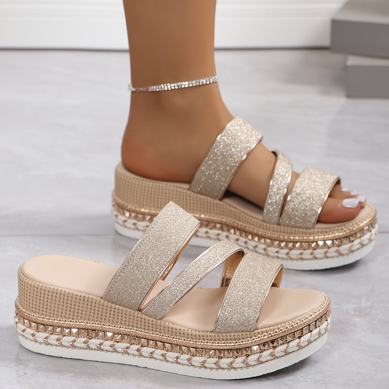 Side profile view of the Mira beige women's flat sandals highlighting the delicate strap detail
