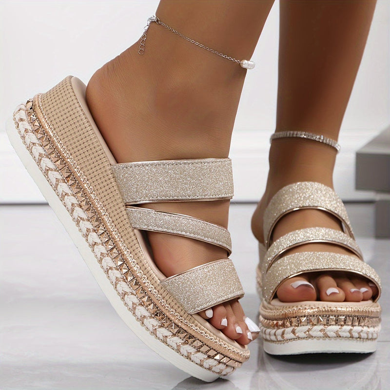 Close-up of the Mira flat sandal straps and cushioned sole in beige