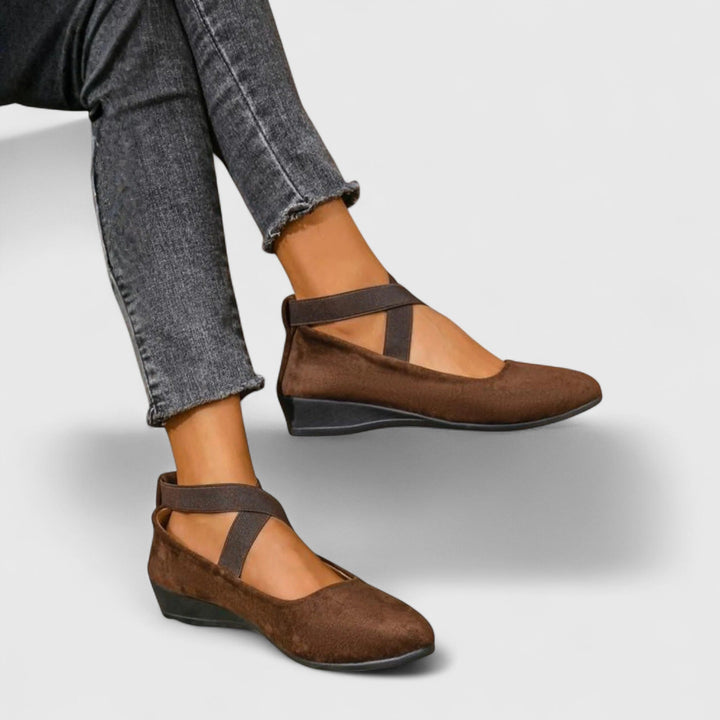 Side view of Nadia suede wedge flats showing the low hidden wedge profile and matte suede-look upper