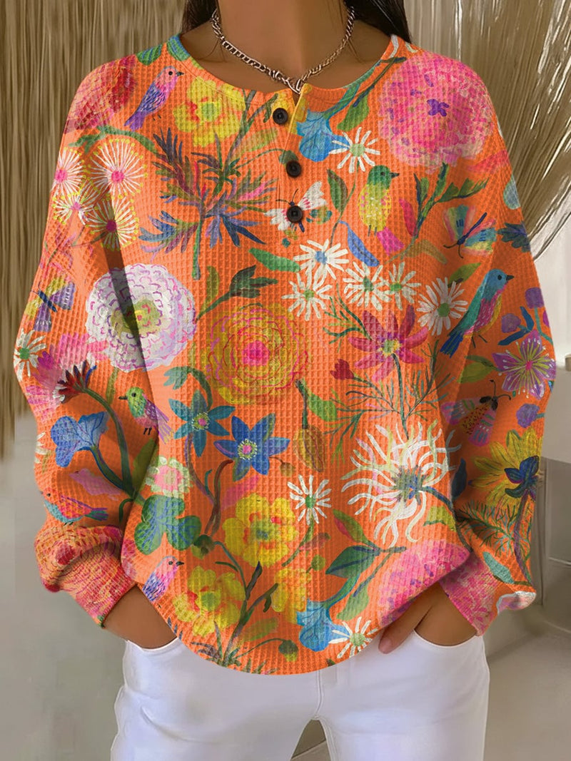 Woman wearing an orange classic pullover sweater with a relaxed, flattering fit from BobaFashion