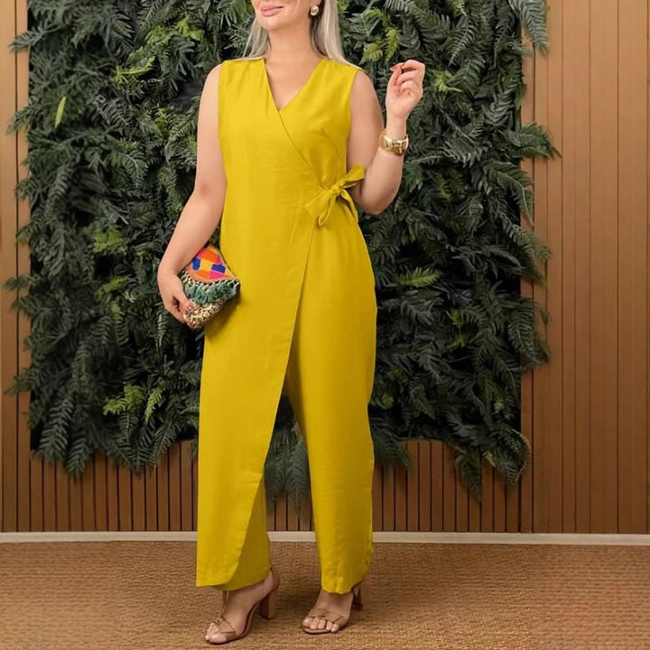 Women's sleeveless tie-waist jumpsuit styled with heeled sandals for an evening-ready look