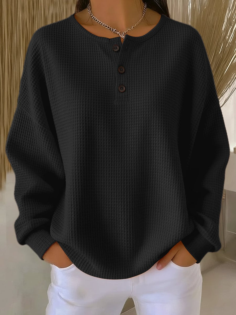 Side profile of model wearing the BobaFashion casual sweatshirt in black, highlighting the relaxed fit and sleeve length