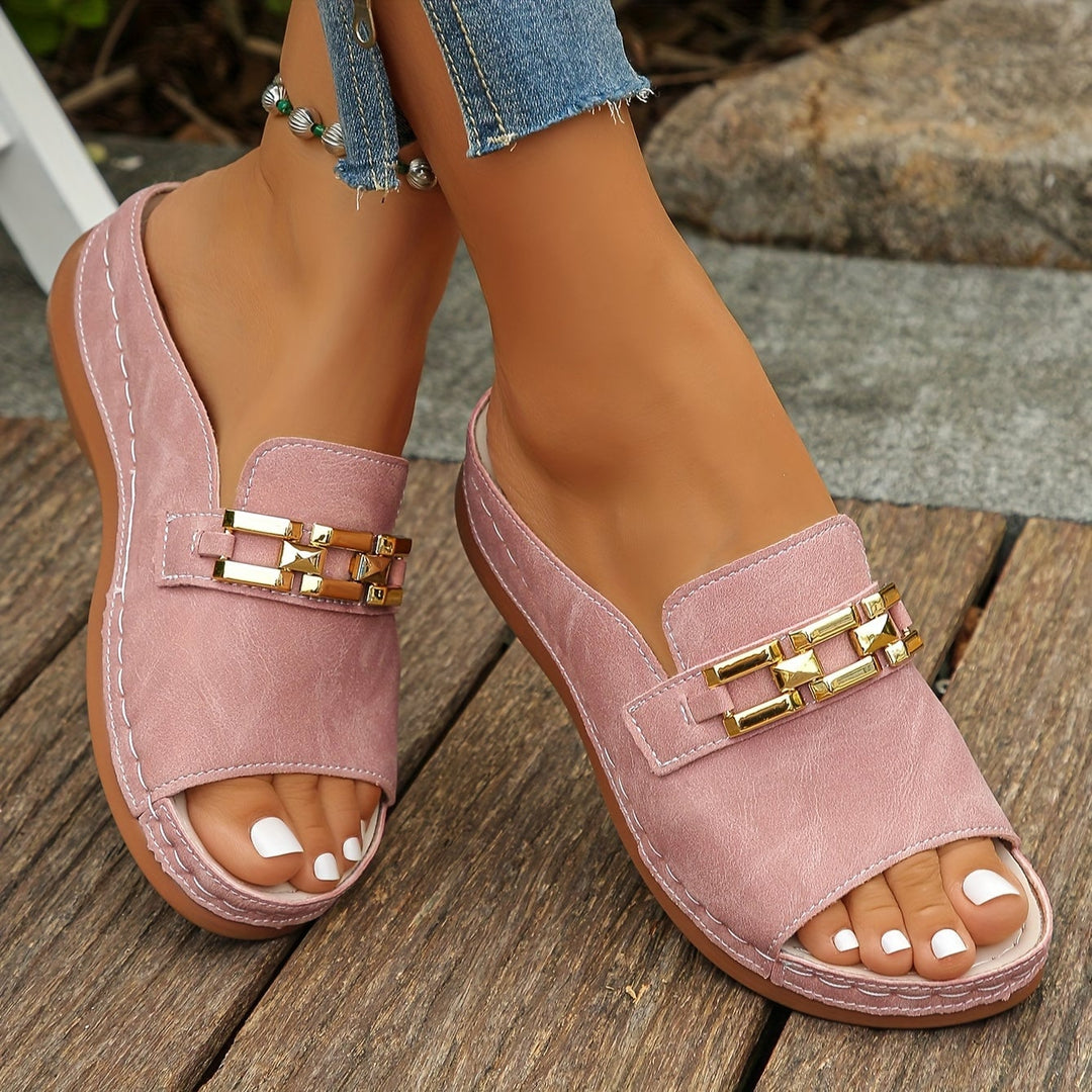 Close-up of gold-link strap detail on Opal cushioned sandals in pink
