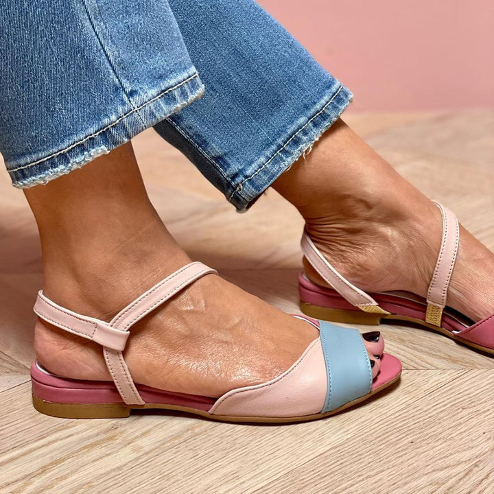 Side view of Ophelia pink flat sandals showing low heel and padded insole detail