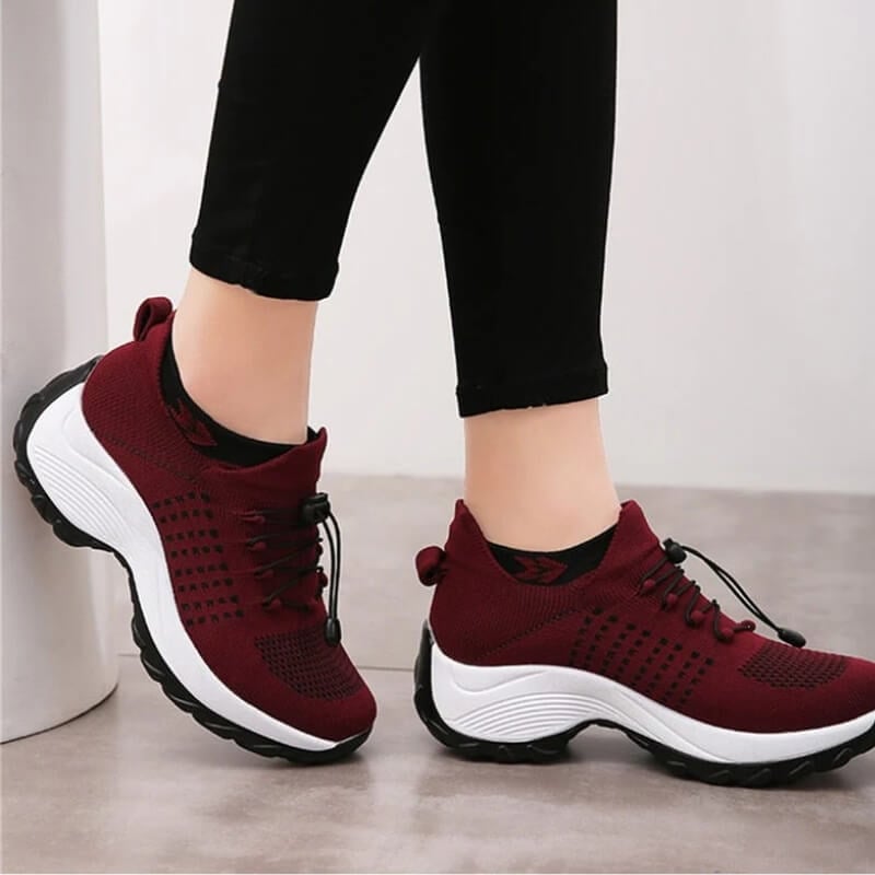 Woman wearing BobaFashion orthopedic comfort shoes while walking on pavement