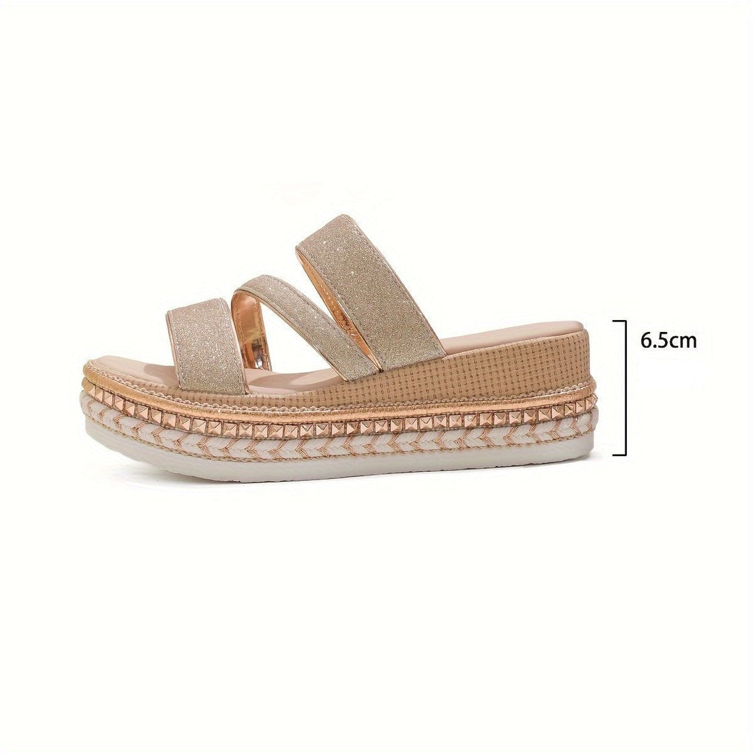 Pair of Pamela cozy spring sandals laid flat on a neutral surface