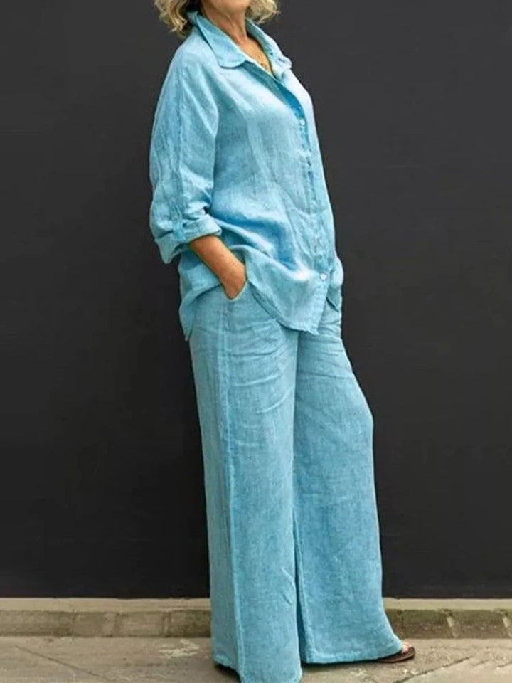 Close-up of the Petra linen shirt collar and full button front detail in blue