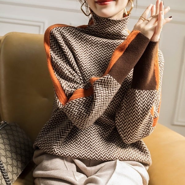 Model wearing the BobaFashion herringbone luxe turtleneck in orange styled with trousers