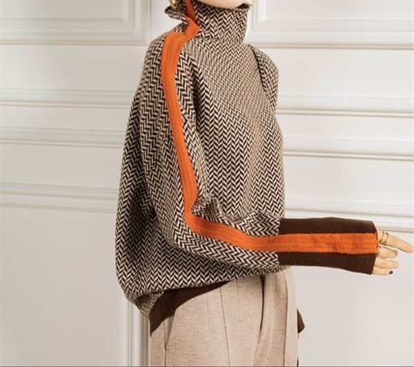 Flat lay of the BobaFashion herringbone turtleneck in green showing the one-size silhouette