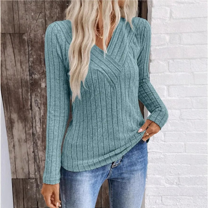 Woman wearing a BobaFashion elegant sunken stripe sweater in peacock blue with a relaxed, flattering fit