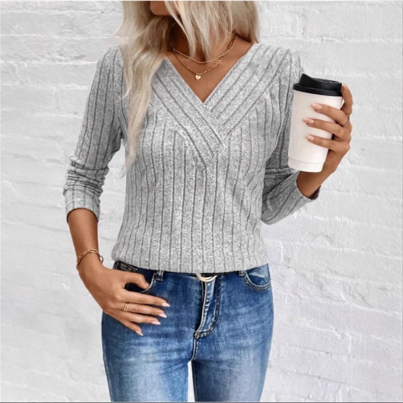 Side view of the BobaFashion sunken stripe sweater showing its graceful drape and relaxed silhouette