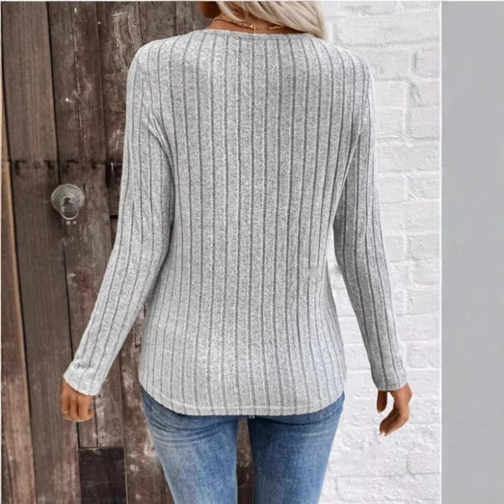 Flat lay of the BobaFashion sunken stripe sweater in peacock blue, black, and gray color options