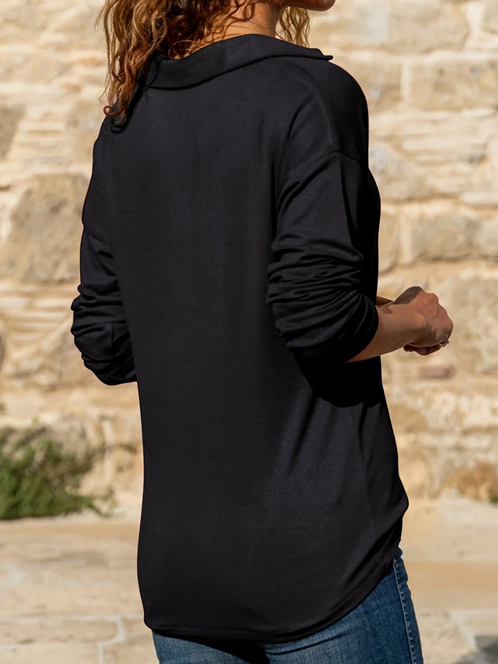Close-up of the half-zip hardware and collar on the Quinn pullover in burgundy