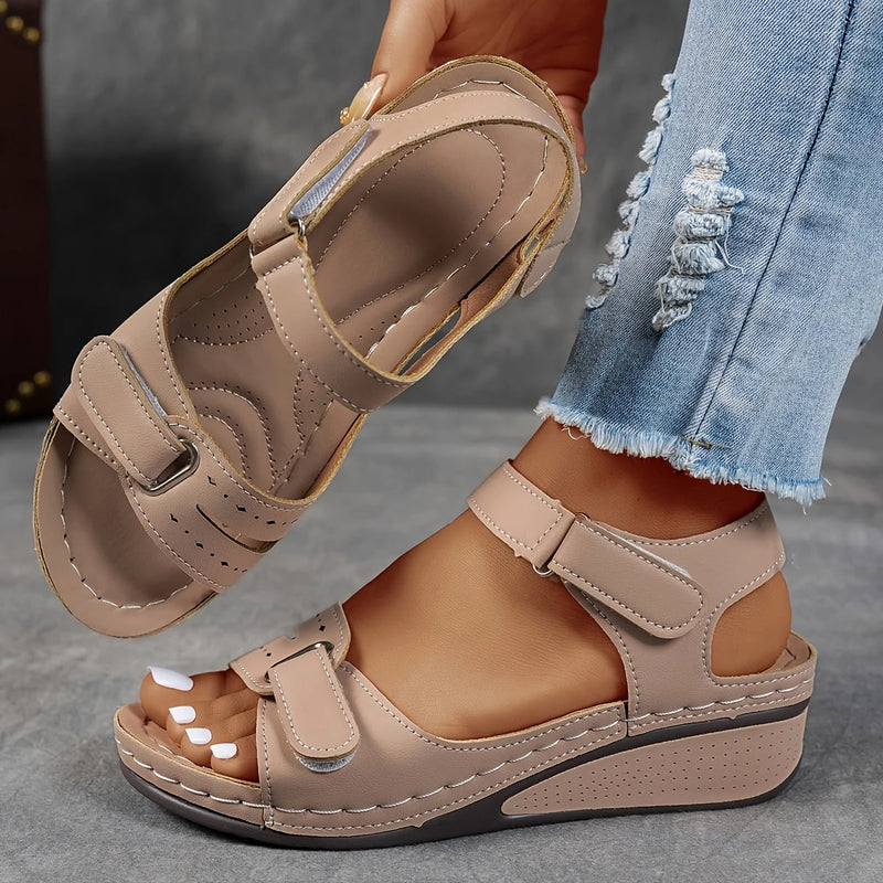 Rae women's platform cushioned wedge sandal in black, side profile view