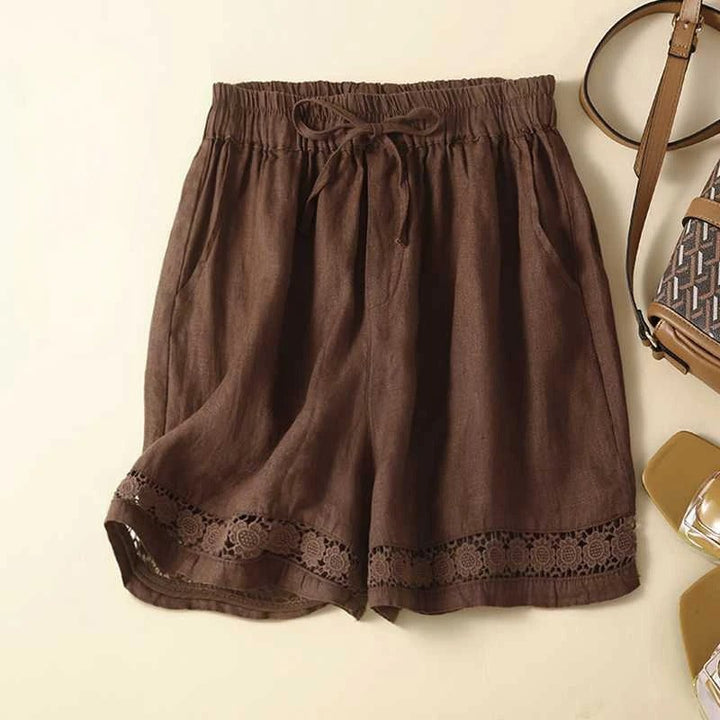 BobaFashion relaxed floral shorts laid flat showing roomy silhouette and embroidered trim detail