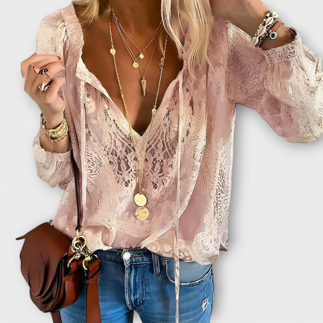 Flat lay of the Rosalynn V-neck lace blouse in black and pink color options