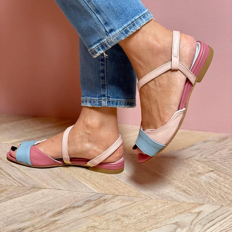 Top-down view of BobaFashion asymmetrical pink sandals highlighting the color block upper and open toe