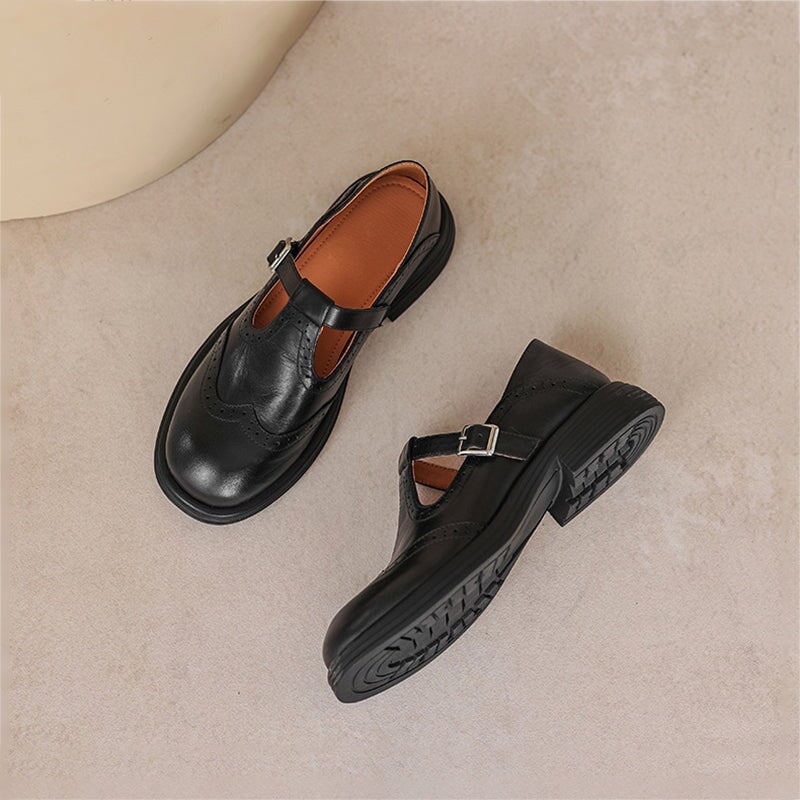 Rosie leather T-strap Mary Jane shoes in black, side profile showing T-strap buckle closure and block heel