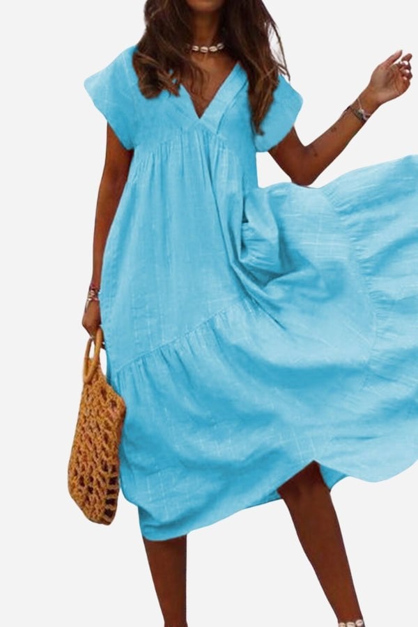 Side view of the Rosie midi dress showing the voluminous tiered ruffle skirt silhouette