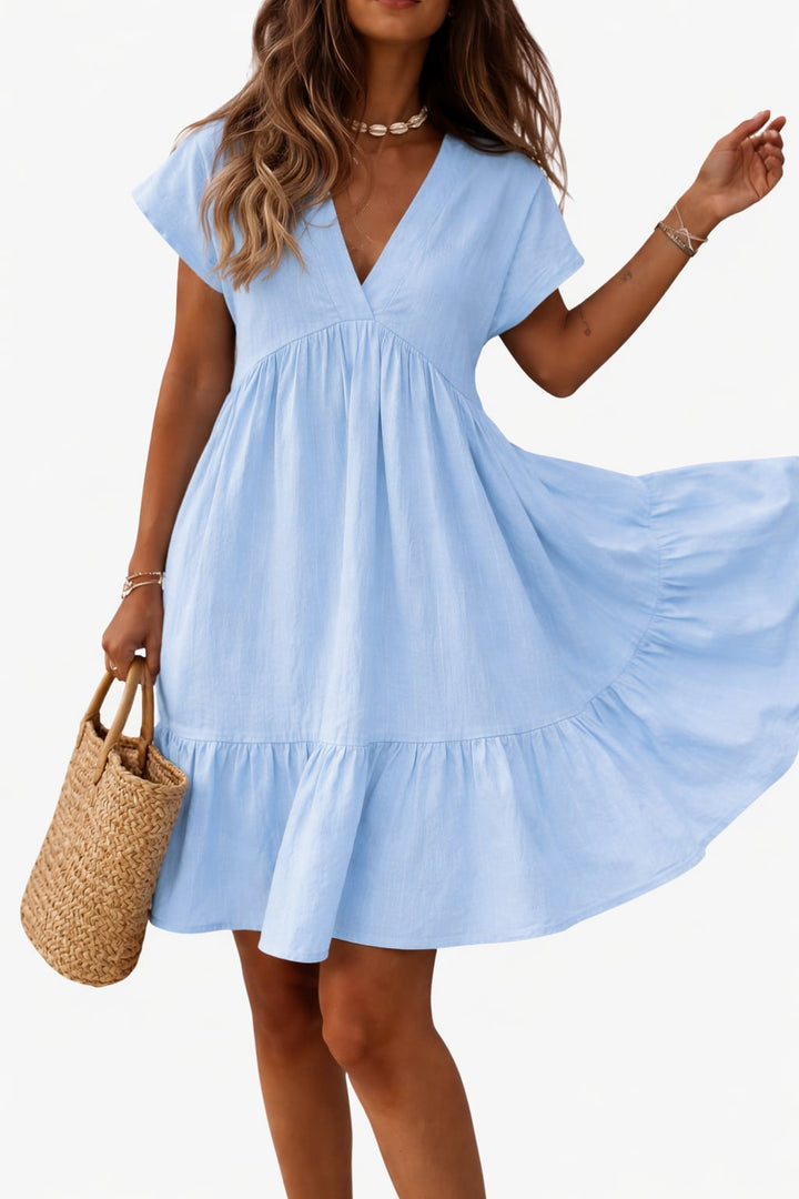 Rosie tiered midi dress in yellow showing the full-length flowing silhouette