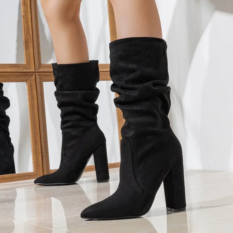 Model wearing BobaFashion Serena slouchy boots in black paired with skinny jeans