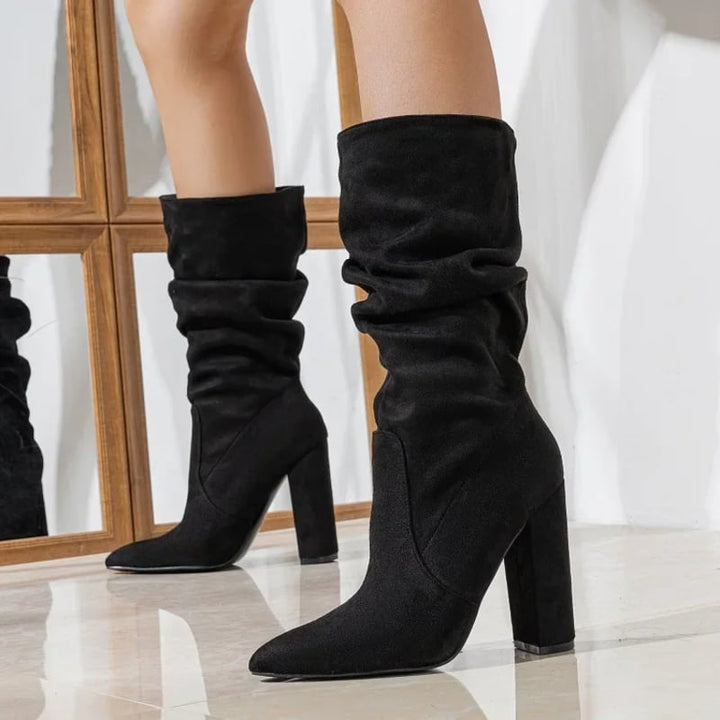 Model wearing BobaFashion Serena slouchy boots in black paired with skinny jeans
