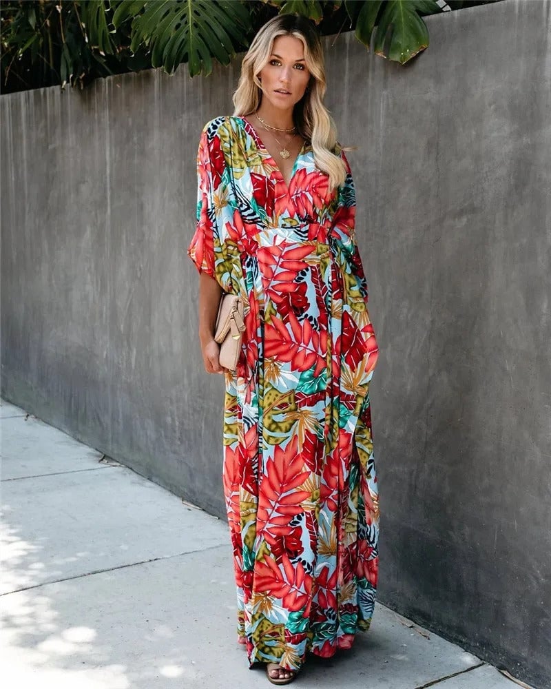 Lifestyle shot of model in the Serena boho wrap maxi dress styled for a wedding guest look