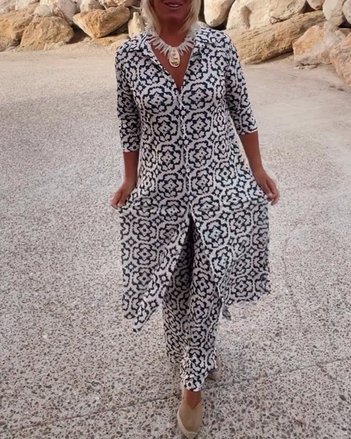 Woman wearing the Serena navy blue geometric print blouse and matching slim pants two-piece set